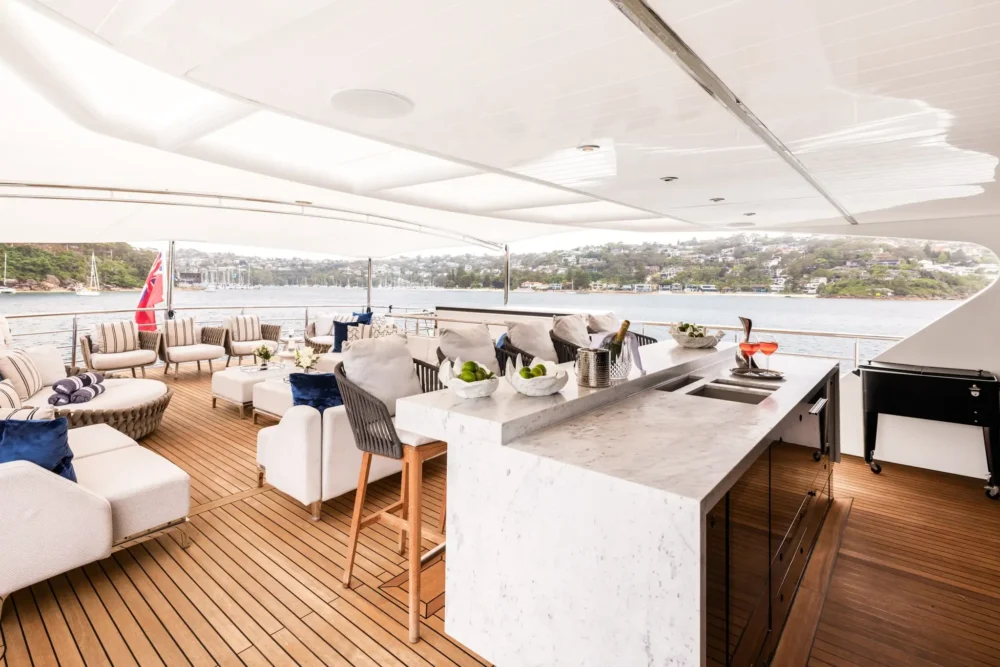 Open-air entertaining space aboard EVOLUTION overlooking the water