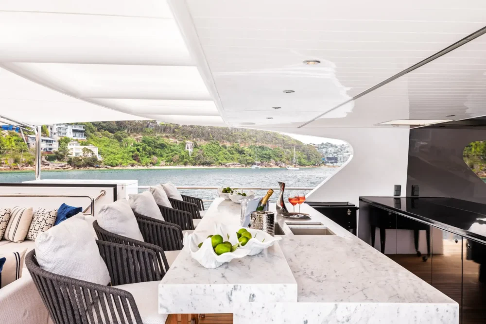 Outdoor lounge and dining area aboard EVOLUTION
